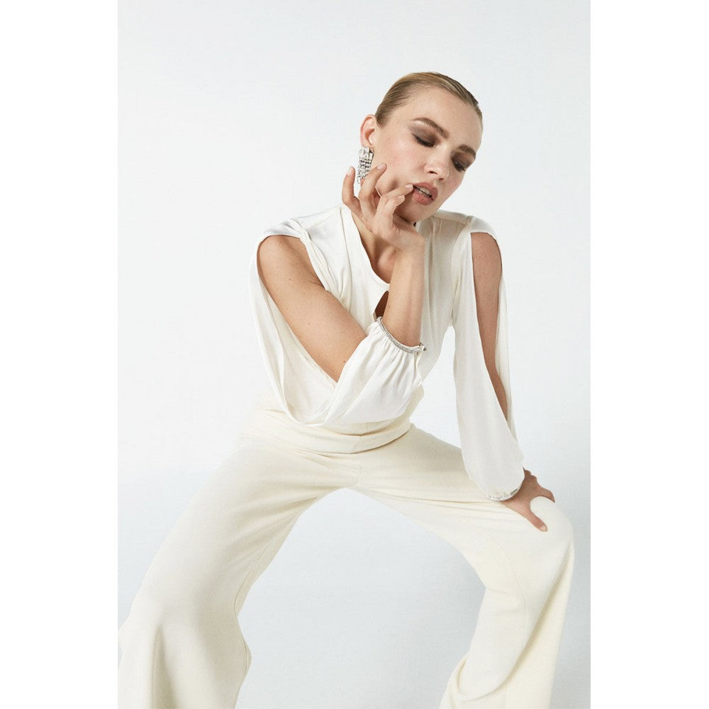 NENETTE Tuta panna elegante con schiena scoperta e maniche lunghe aperte