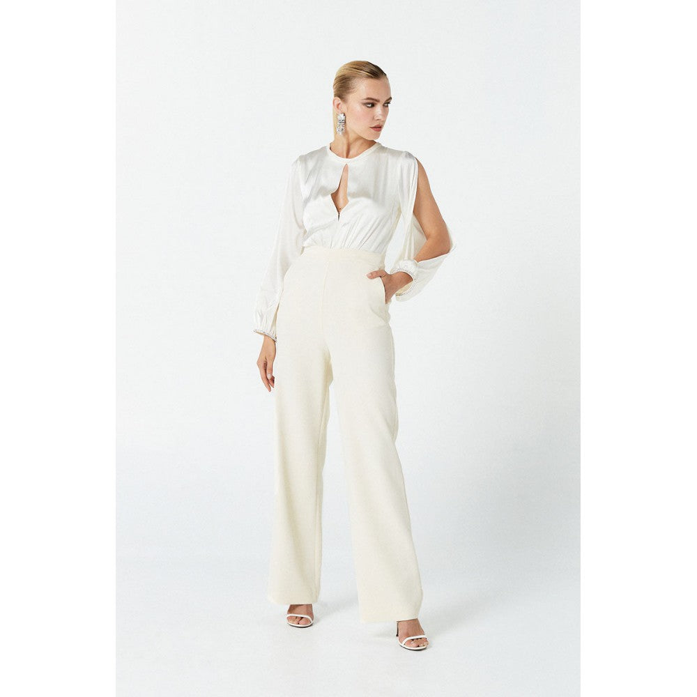 NENETTE Tuta panna elegante con schiena scoperta e maniche lunghe aperte