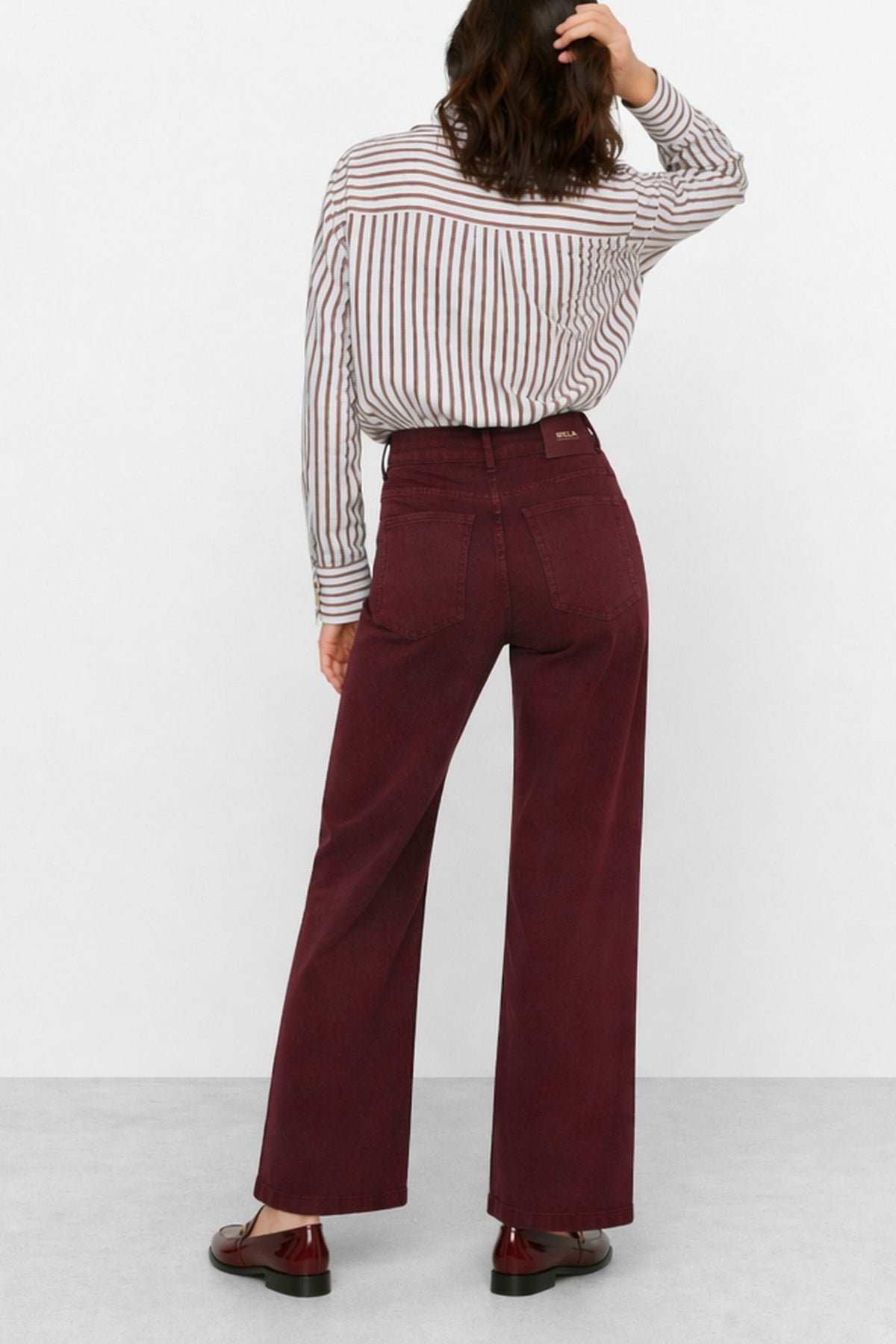 KOCCA Jeans color bordeaux gamba dritta e fibbiette oro