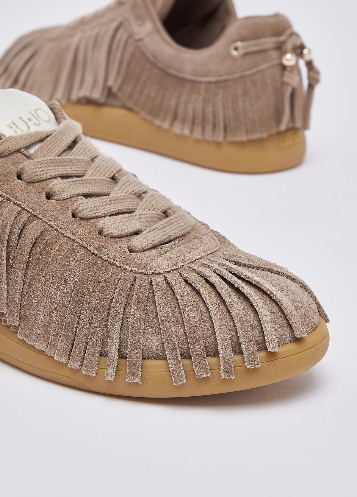 Sneakers in suede con frange