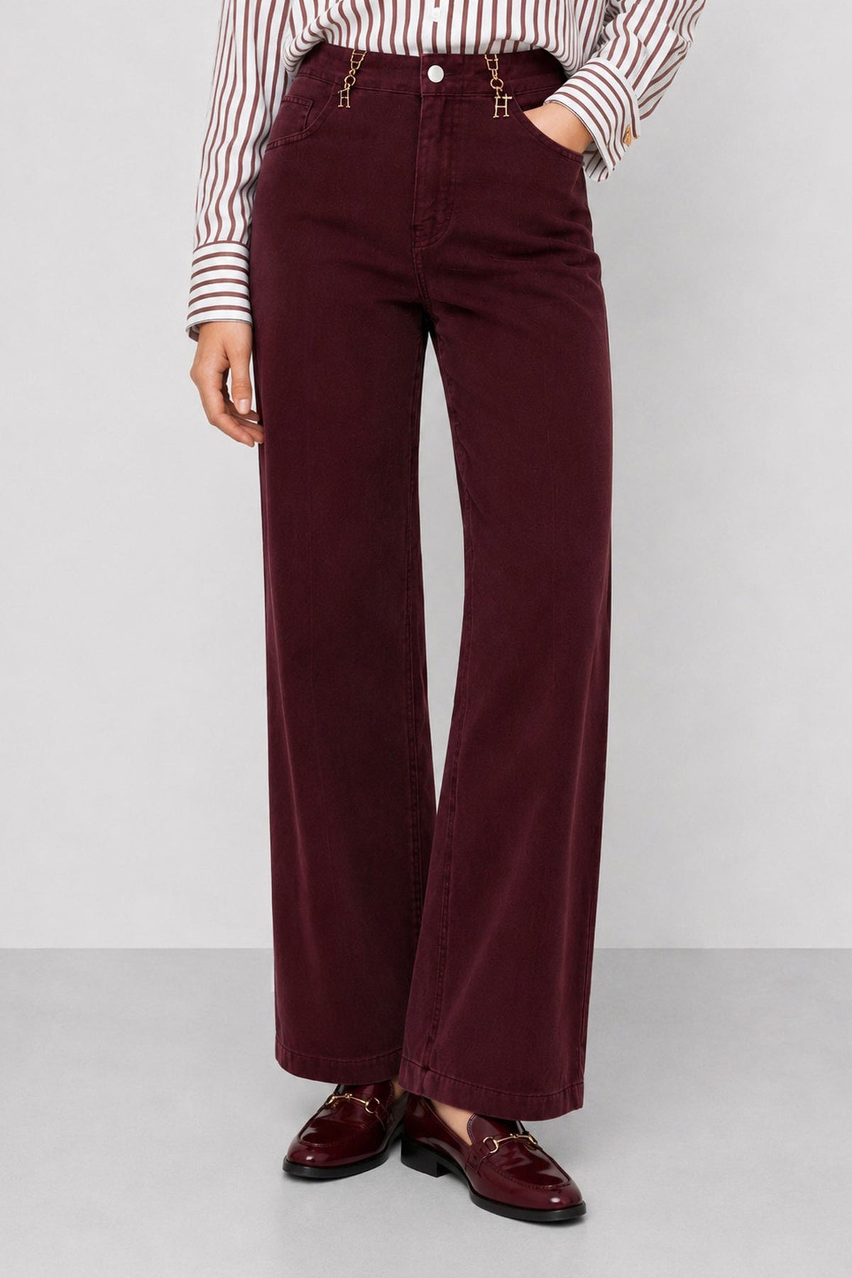 KOCCA Jeans color bordeaux gamba dritta e fibbiette oro