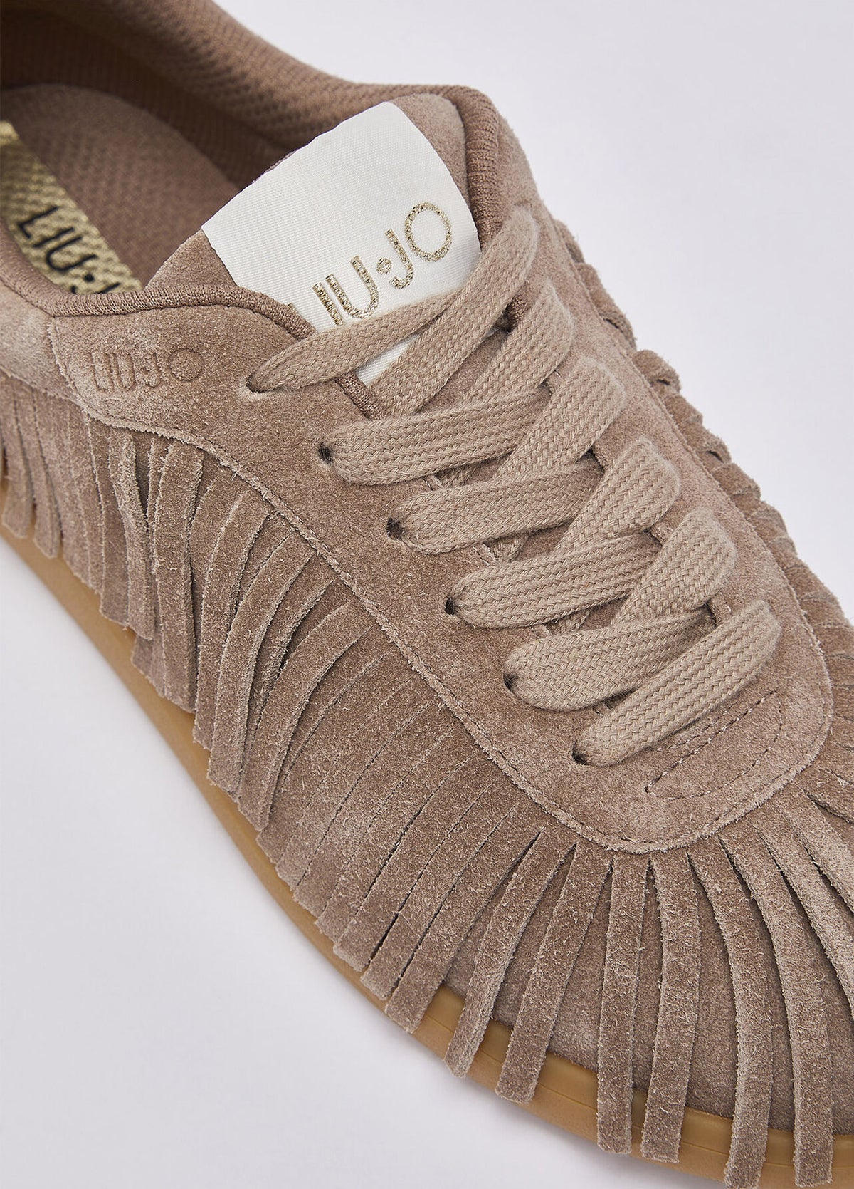 Sneakers in suede con frange